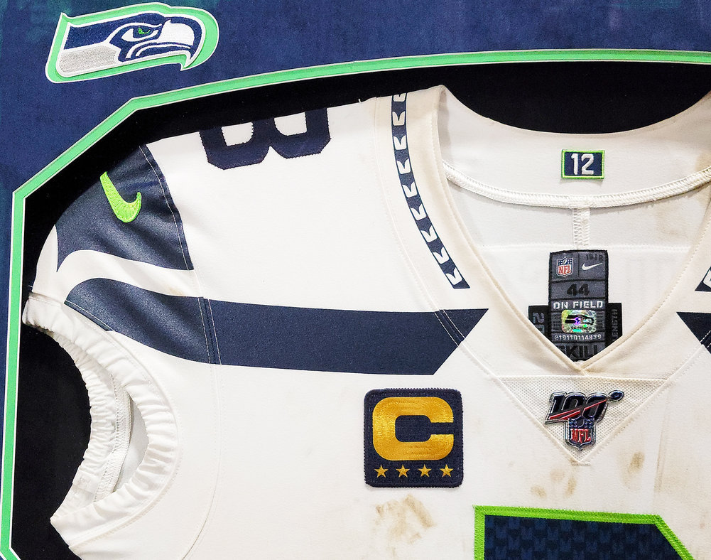 Russell Wilson Framed Game Used Seattle Seahawks White Nike Jersey With Captain's Patch & NFL 100 Logo Unsigned #203517 Image a