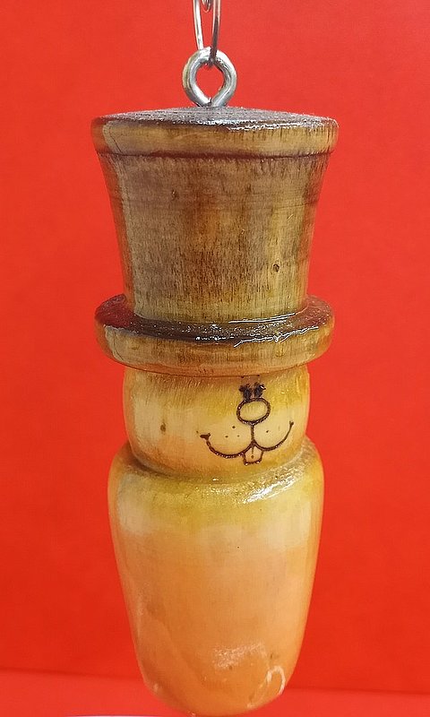 *Hand carved spindle ghog orn.