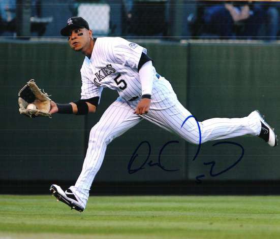 COLORADO ROCKIES CARLOS GONZALEZ SIGNED BLACK JERSEY 8X10