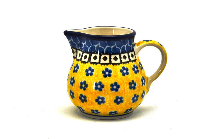 3"H x 2 3/4"W x 3 5/8"L. 
 Polish Pottery Creamer - 4 oz. - Sunburst 091-859a (3"H x 2 3/4"W x 3 5/8"L.  
)